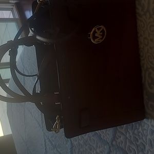 A Michael Kors purse beautiful never used